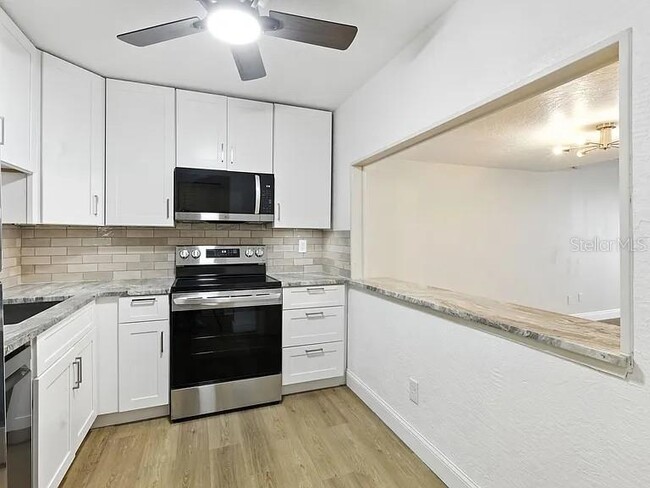 Photo - 7665 Sun Island Dr S Unit 211