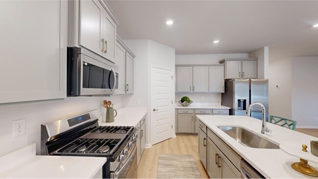 Craft new and old recipes with ease thanks to the new stainless steel range and built-in microwave - 15580 Ruthie Lynn Dr Unit A