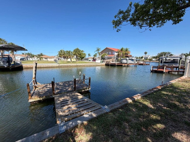 Building Photo - "Waterfront Home with Dock! 3-Bedroom Oasis with 2 Baths and 1,800 Sq Ft of Comfort in Hudson, FL!"