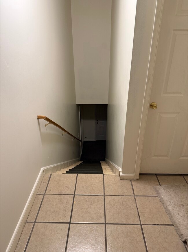 Wash and Dryer door to right, stairs up to unit - 218 N Queen St Unit 218-C