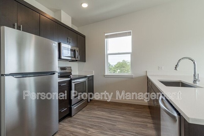 Building Photo - 1111 W Fourth Plain Blvd Unit 301