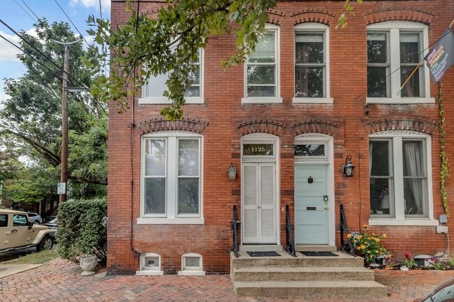 Building Photo - Timeless Brick Rowhome Steps from King Street