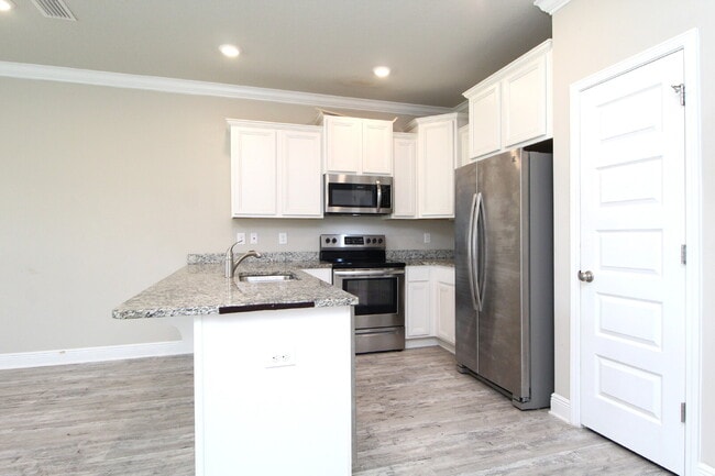 Photo - Spacious 3-Bed, 2.5-Bath Townhome Steps from Blue Wahoos Stadium & Palafox Street with Upgraded K...