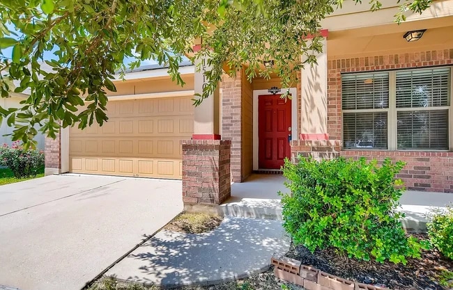 This charming red entrance door is hard to miss! - 15106 Parrish Ln