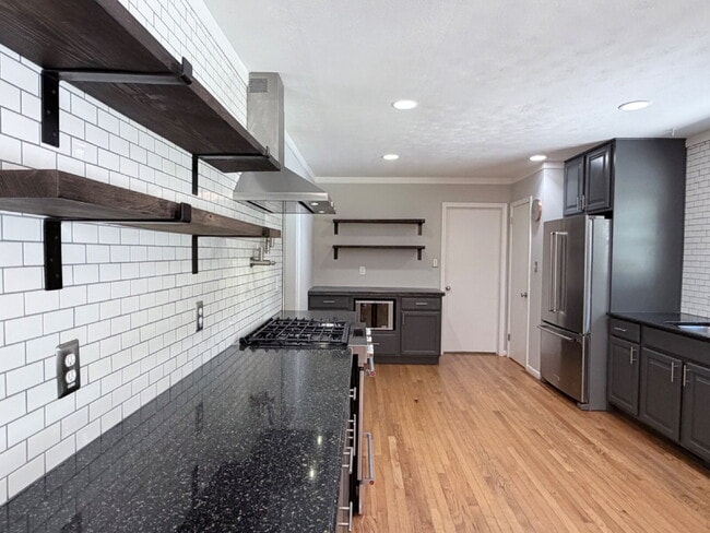 Photo - Updated 3BR Home in Beaver Lake | Fenced Yard, Garage, Covered Porch & Outdoor Fireplace | Pet Fr...