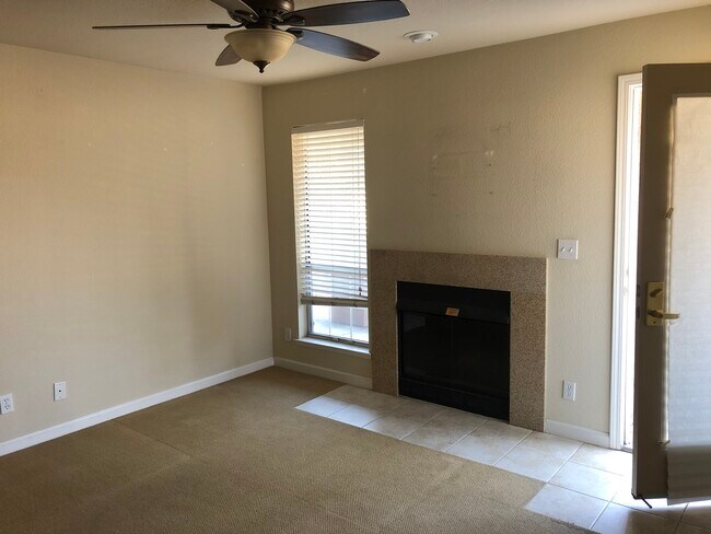 Living room/fireplace - 631 E El Camino Real Unit 203