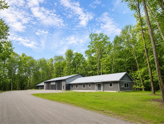 Very Private duplex. 4000 sq ft of garage between residencies. - 10671 US 31