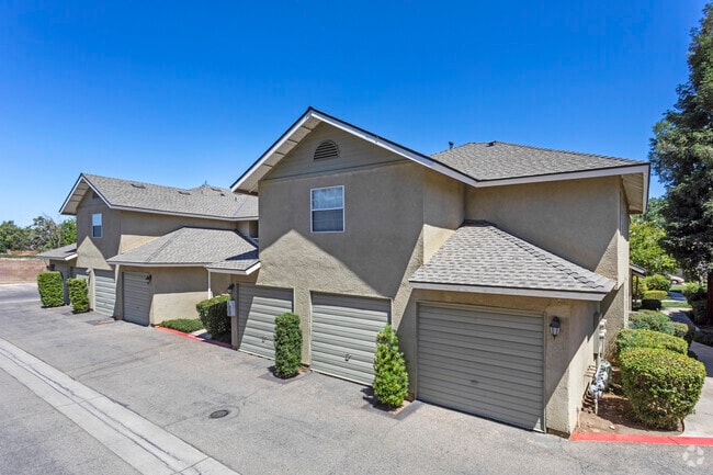 Exterior Building with Garage - Cottonwood Grove Apartments