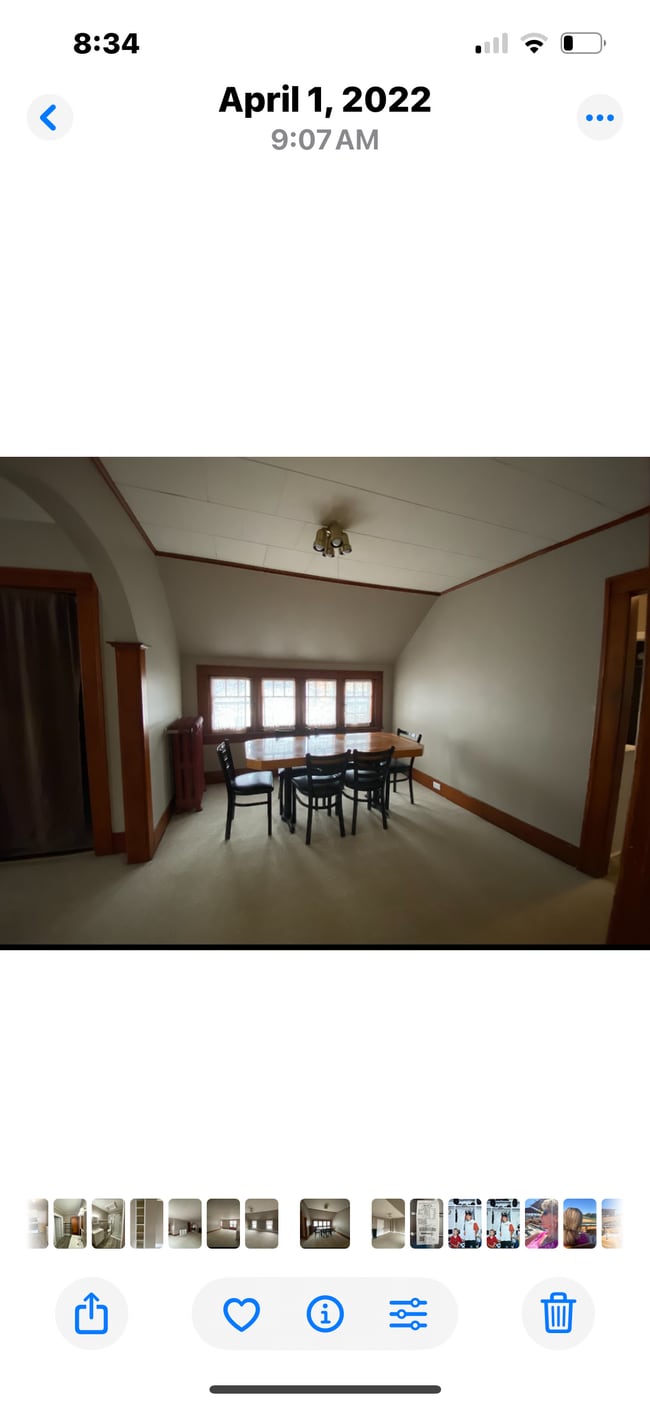 Spacious dining area with table and chairs. - 810 E Front St