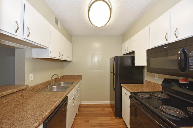 Sleek Galley Kitchen - Croley Court Apartments