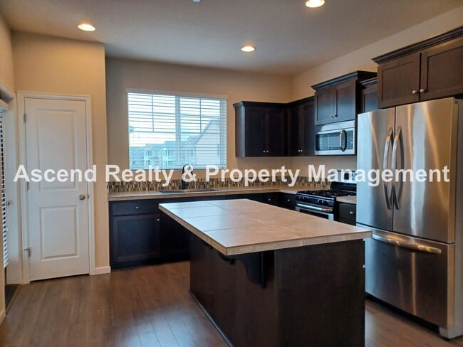 Photo - 3 Level End Unit Townhome with Newer Carpet, Open Floor Plan, 2 Balconies, 2 Car Attached Garage ...