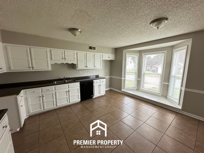 Photo - Charming 3BR/2BA Near Southwind | Vaulted Ceilings, Hardwood Floors & 2-Car Garage