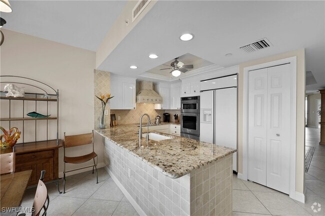 Building Photo - 7117 Pelican Bay Blvd Unit 1101 Rental