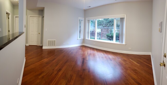 Living Room with Brazilian Cherry Hardwood Floor 13.5' x 15.5' - 4648 N Saint Louis Ave Apartments Unit 1B