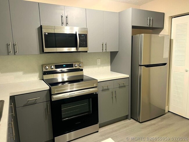 Building Photo - 11241 W Atlantic Blvd Unit 204