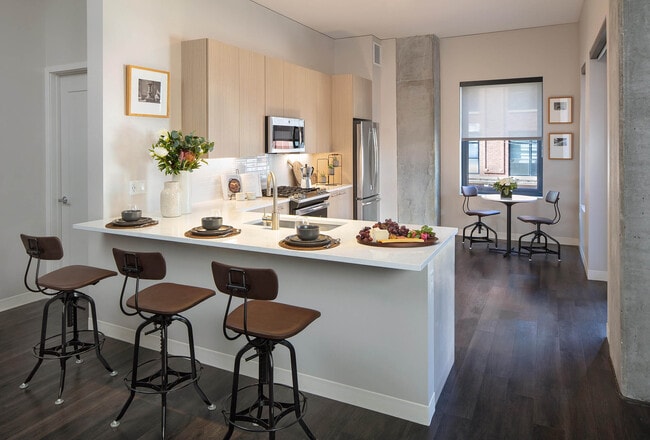Spacious kitchen with bar seating and dining nook