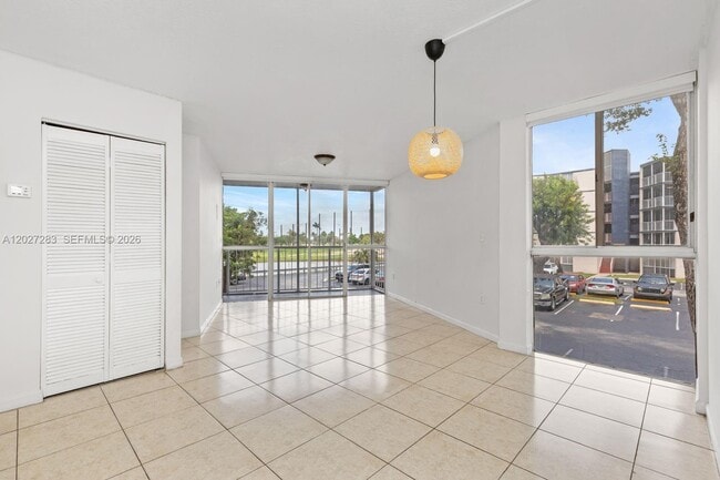 Building Photo - 6995 NW 186th St Unit E202