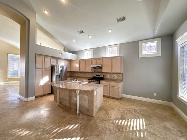Photo - Gorgeous home with travertine tile flooring in the Rhodes Ranch guard gated community! The kitche...