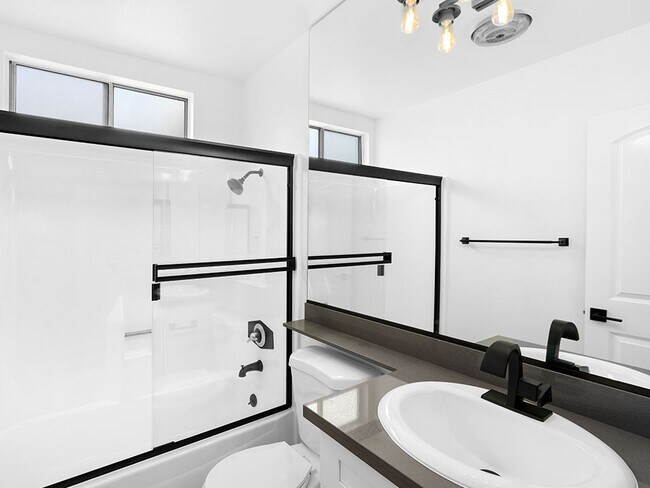 Modern styled bathroom with shower and tub.