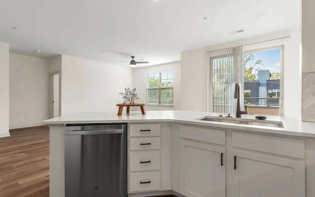 Spacious Kitchen with White Cabinets and Stainless Dishwasher - The Maggie