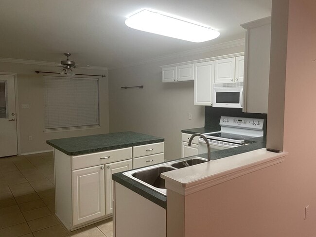 Photo - 3/2 Central heat and air, washer dryer connections