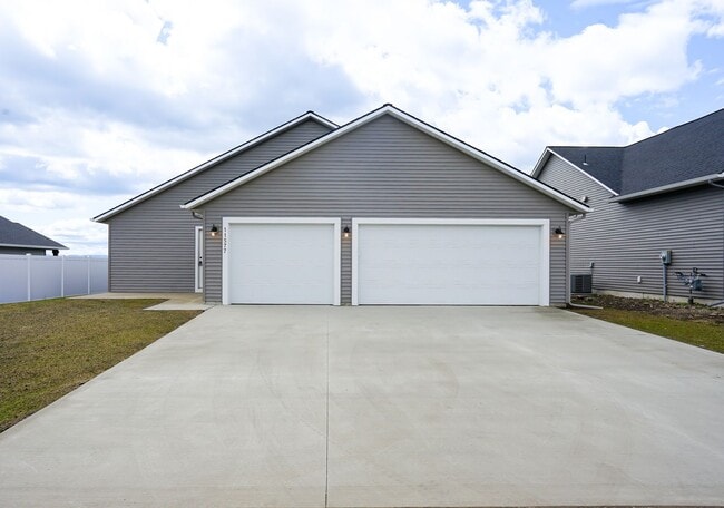Photo - Newly built home with 3 car garage