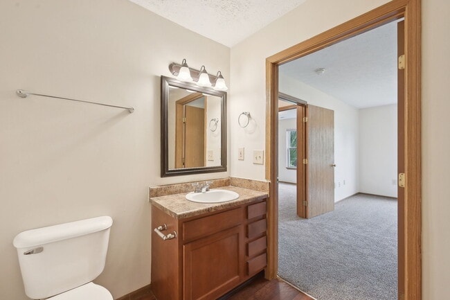 Dooley's Orchard unit showing a master bedroom and bathroom.