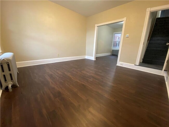 Photo - Charming three-bedroom row house available...