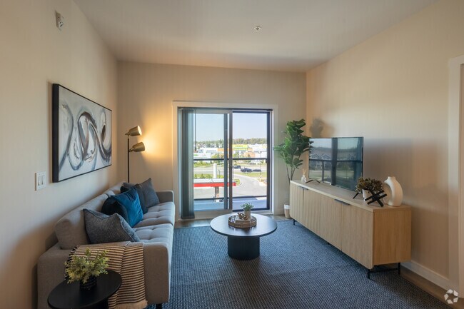 2BR, 2BA, +Den - 931SF - Living Room - Vista Apartments at Edgemont