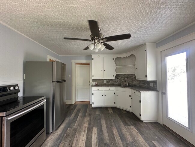 Full kitchen with range, refrigerator, and pantry space - 363 Concord Rd Unit 2