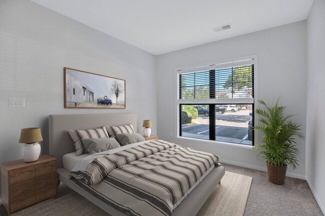 Spacious bedroom with plush carpeting