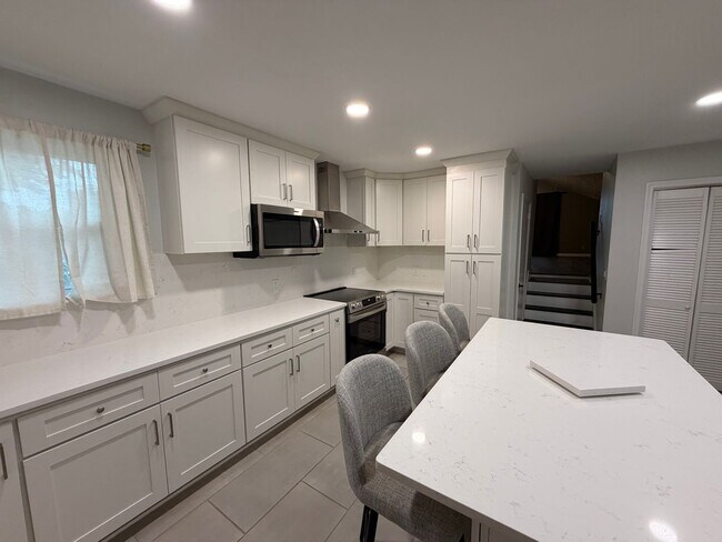 Photo - Spacious Bellevue Home with Bonus Loft, Sunroom & Private Fenced Yard!