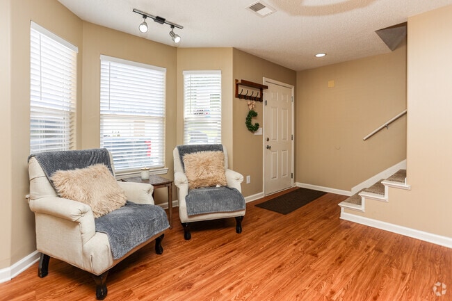 2BR, 1.5BA with Garage - 1,060SF - Living Room - Colonial Apartment Complex