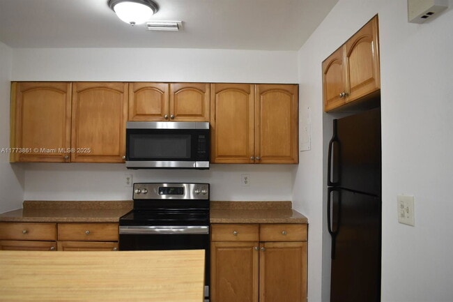 Building Photo - 9150 NW 38th Dr Unit 110A