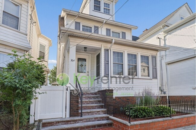 Photo - Spacious 4BR Single-Family Home with Garage, Driveway & Fenced Yard in Kearny