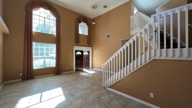 Photo - Spacious 4/3.5 Pool Home with Water View & 3-Car Garage in Lee Vista Area (close to Lake Nona)