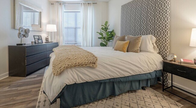 There is room for the bed, a dresser and a nightstand on each side.
