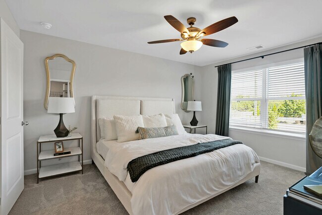 Bright bedroom with ceiling fan and private en-suite bathroom - Covey Homes Kirkland