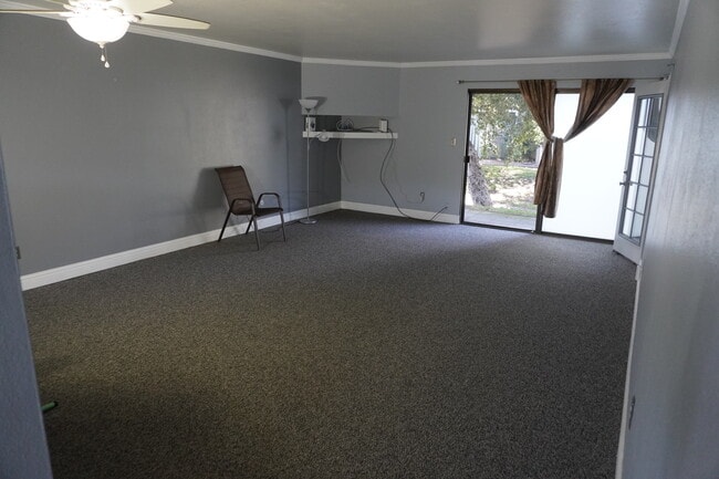 Family room with sliding door to back patio. - 6518 Embarcadero Dr Unit 13