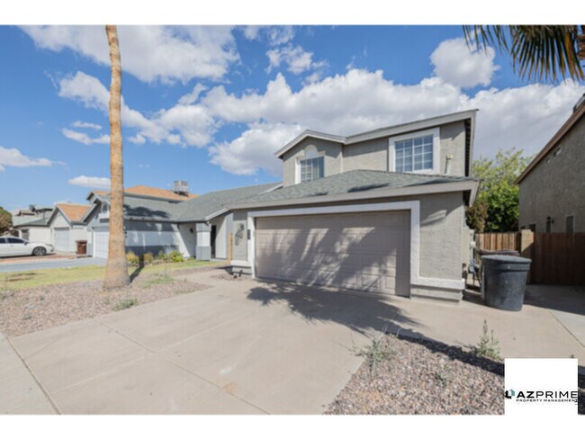 Building Photo - From The Moment You Arrive, This Gorgeous Remodeled 3/2.5 Peoria Home Captivates With Its Sun-Drench
