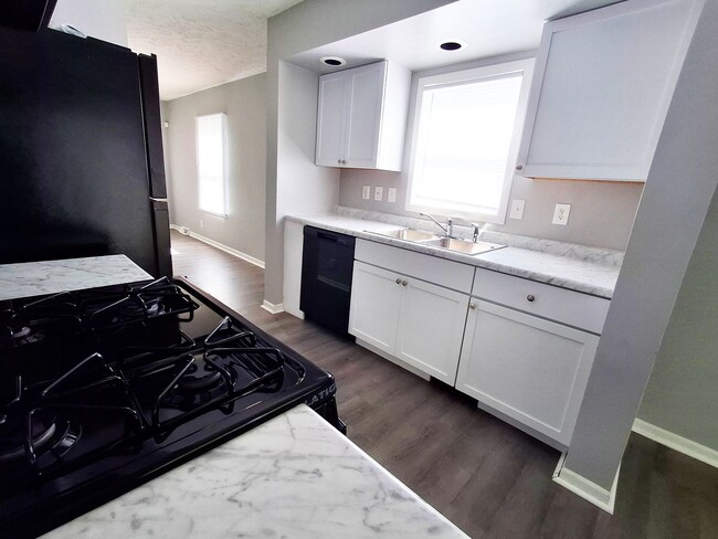 Photo - 4 Bed / 2 Full Bath House with Brand-New Kitchen, Attached Garage, and Full Basement - Built 2001
