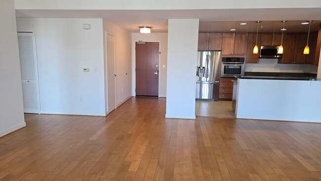 Living room and open concept kitchen - 175 W Saint James St Unit 1309
