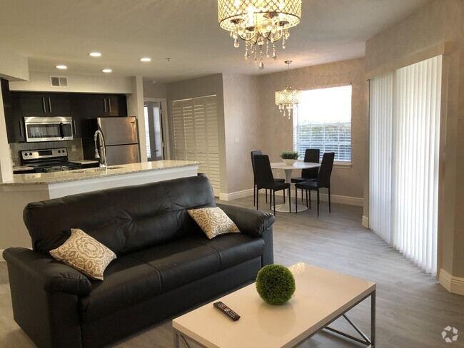 Living Room fully furnished with modern decor! - 7350 Westpointe Blvd Unit 212 Rental