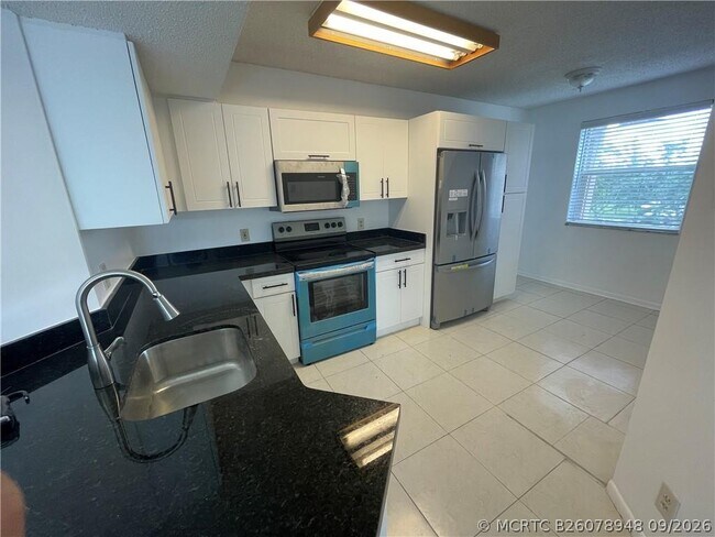 9033 Wiles Rd Unit 302