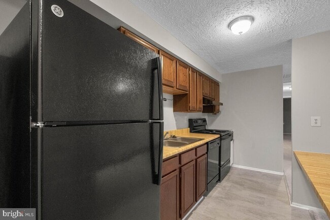 Building Photo - 12415 Hickory Tree Way Unit M