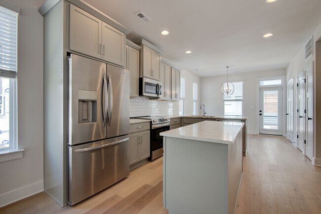 Photo - COMING SOON! Modern End-Unit Living Near Uptown | Rooftop Terrace + Tandem Garage