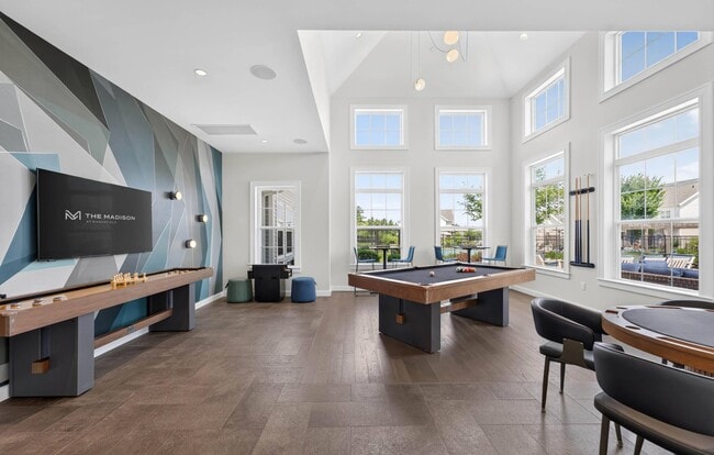 Billiards, shuffleboard and cards all fit in one double-height room.