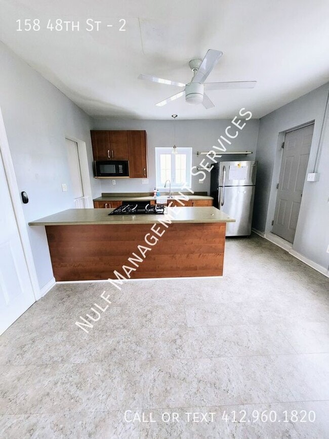 Building Photo - 158 48th St Unit 2