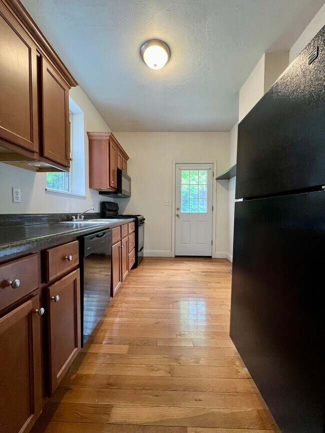 Photo - Lovely Two Bedroom Townhome with Hardwood Floors throughout! Washer & Dryer Provided!