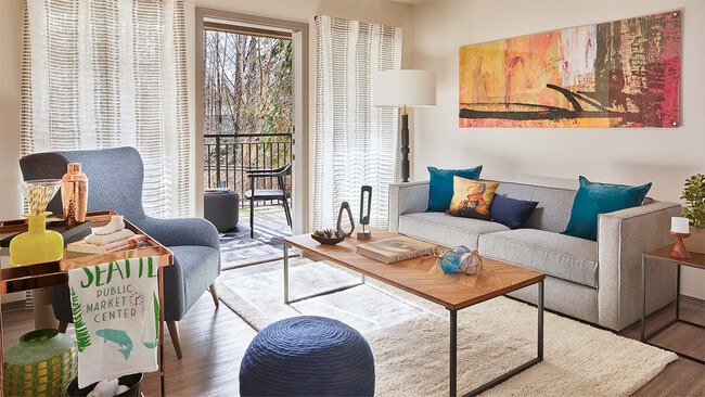 Apartment Living Room with wood flooring and balcony.